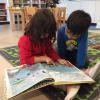 Looking in the map of the world book!